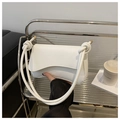 Minimalist white leather shoulder bag featuring unique knotted strap and gold hardware - White