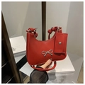 Red retro glossy underarm bag featuring silver bow detail and knot strap design - Red