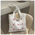 White corduroy tote bag featuring contrast red embroidered letters for daily use - White