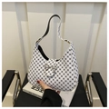 Dettaglio della fibbia a fiocco in metallo argento e stampa geometrica sulla borsa hobo - Bianco