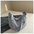 Light blue corduroy hobo bag with embroidered white letters and adjustable strap - Blue