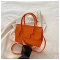 Chic vibrant orange structured handbag with top handles and adjustable crossbody strap - Orange