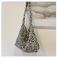 Detail of leopard print canvas tote bag with a knotted wide shoulder strap for women - White