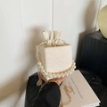 Creamy white lace embossed box bag with pearl handle and golden chain strap - White