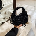 Minimalist black PU leather crescent handbag with embossed pattern and gold hardware - Black