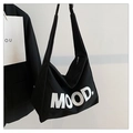 Close-up of black canvas tote bag with white MOOD lettering and durable zipper closure - Black