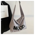 Detail of grey canvas tote bag with black MOOD print and sturdy wide shoulder strap - Gray