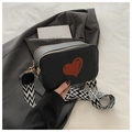 Black pebbled leather crossbody bag with red heart print and patterned wide strap - Black