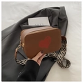 Brown crossbody camera bag with red heart pattern and wide geometric shoulder strap - Brown