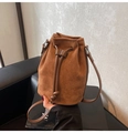 Detail of vintage brown suede bucket bag with smooth leather drawstring and silver hardware - Brown