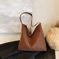 Brown faux suede tote bag with minimalist retro design on a black blazer jacket - Coffee