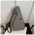 Detailed view of gray nylon crossbody bag with metal zipper and adjustable strap - Gray