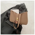 Chic beige leather shoulder bag with a sleek gold twist lock and a modern curved top - Khaki