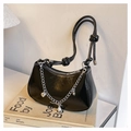 Black patent leather half-moon bag with pearl chain charms and silver hardware accents - Black