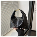 Detail shot of black faux leather hobo bag featuring mioashe embossed logo and gold hardware - No Pendant / Black