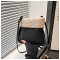 Detail of black matte crossbody bag featuring plush beige faux shearling trim and strap - Black (Without Charm)