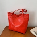 Chic red tote bag with crocodile texture and long handles for shoulder carry - Red