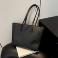Minimalist black tote bag in matte PU leather with vertical stitching and long handles - Black