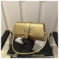 Golden crocodile pattern crossbody bag with round metal handle and silver lock - Gold