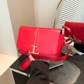Minimalist bright red shoulder bag featuring a gold T-shaped metal buckle on leather - Red
