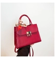 Fuchsia leather handbag with gold metal clasp and patterned silk scarf handle wrap - Red