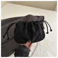 Detail of black pleated cloud bag with drawstring and silver metal chain strap - Black