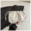 Detail of white pleated drawstring bag with marble texture and metal chain strap - White