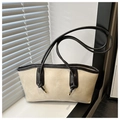 Detail of off-white tote bag with black contrast piping and long knotted shoulder straps - No Pendant / White