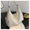 Cream corduroy tote bag with adjustable shoulder strap and vertical ribbed texture - White