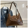 Detail view of brown vintage leather tote bag with gold hardware and embossed fashion logo - No Pendant / Brown