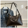 Detail of deep brown faux leather tote bag with metal buckles on denim jacket background - No Pendant / Brown