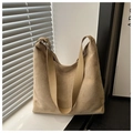 Detail of khaki suede tote bag showing soft matte texture and wide shoulder strap - Khaki