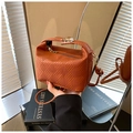 Orange woven leather crossbody bag with gold buckle and stylish top handle design - Brown