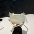 Chic cream white crescent handbag with silver metal chain and thin shoulder strap - White