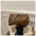 Brown leather cylindrical crossbody bag with vintage geometric woven shoulder strap - Brown