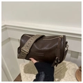 Brown cylindrical crossbody bag with textured leather and woven wavy shoulder strap - Coffee
