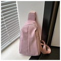 Close-up of pink nylon waist bag featuring pleated design and silver metal zippers - Pink