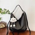 Black half-moon tote bag in matte faux leather with a cute white cloud plush pendant - Tote Bag With Cloud Charm / Black