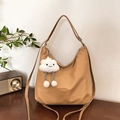 Khaki large capacity nylon tote bag with plush cloud charm on a wooden desk - Tote Bag With Cloud Charm / Khaki