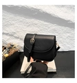 Classic black saddle crossbody bag in matte faux leather with gold buckle detail - Black