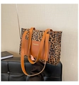 Detail of leopard print tote bag featuring leather front pocket and Fashion & Bags text - Brown