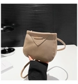 Detail of beige pebble leather crossbody bag with minimalist gold metal bar closure - Brown