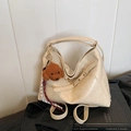 Chic beige large capacity hobo bag with teddy charm and braided strap detail - White With Pendant