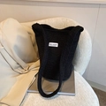 Black wool bucket bag with 'Love Fashion' label on a stylish beige coat backdrop - Black Without Pendant