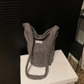 Dark grey knitted bucket bag with wide strap and minimalist white woven label detail - Gray Without Pendant