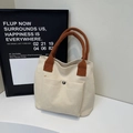 Sac fourre-tout minimaliste en toile crème avec anses brunes et poche à bouton-pression - Blanc Cassé