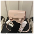 Detail of light pink saddle bag with silver lettering and adjustable shoulder strap - Pink