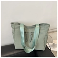 Large sage green nylon tote bag with decorative drawstrings and wide woven shoulder strap - Green
