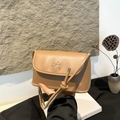 Minimalist light brown leather crossbody square bag featuring a delicate silver bow buckle - Khaki