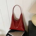 Glossy burgundy leather tote bag with minimalist triangular design and long shoulder straps - Red